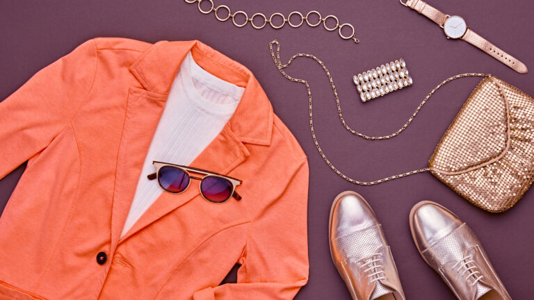 elegant-clothing-and-accessories-arranged-on-backg-2026-01-08-22-11-40-utc