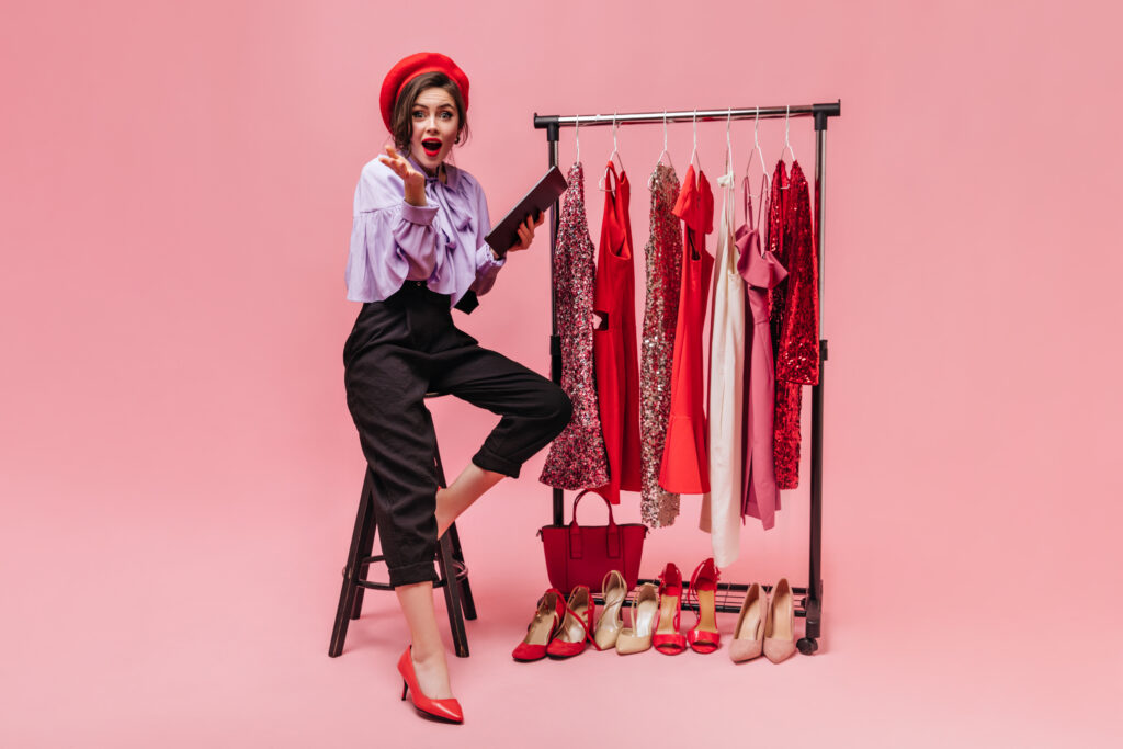 woman-showing-off-her-selection-of-dresses-2026-03-09-07-08-45-utc